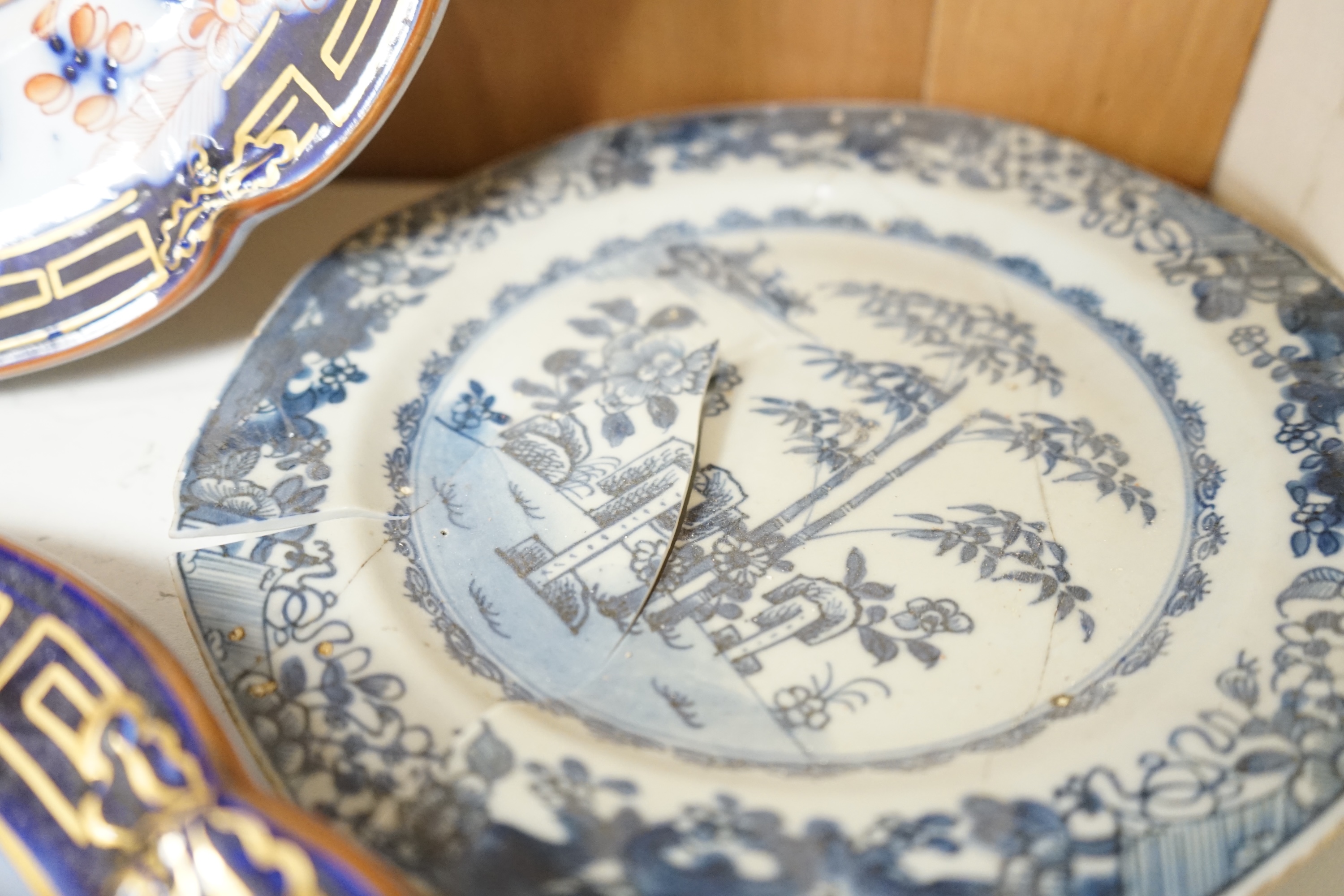 A Staffordshire flow blue ironstone part dinner service, comprising twenty-two 26.5cm diameter plates, seven 23.5cm diameter plates, ten 26.5cm diameter dishes, two small serving dishes and three large serving dishes, la